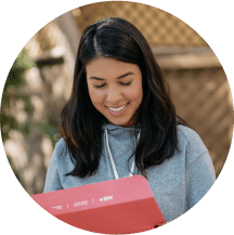 a woman holding an ace fitness personal trainer study guide located on the ace fitness personal trainer certification webpage